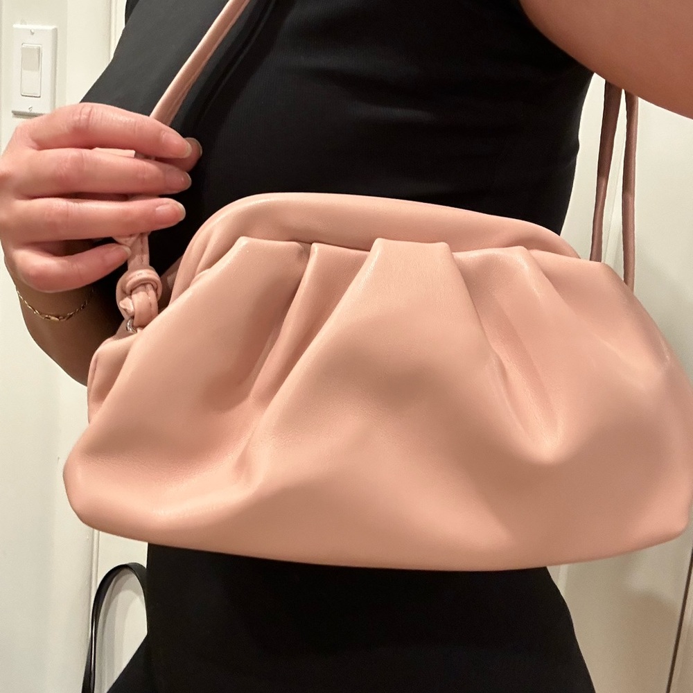 Pink clam shell style bag.